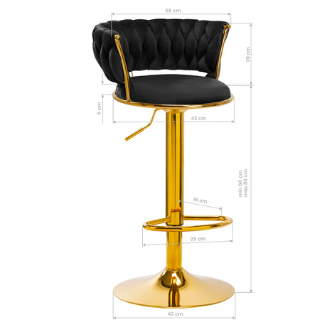 a golden bar stool with a black seat