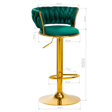 a golden bar stool with a green cushion