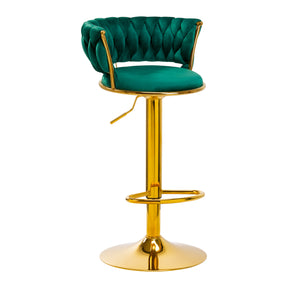 a green velvet bar stool with a gold base