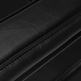 Close-up of Pro Ink 604 Electric Tattoo Chair Black armrest padding, emphasizing its premium leather finish and comfort.