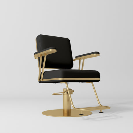 Manufakturo Opéra styling chair in Black with padded armrests, a gold-finished round base and metal footrest