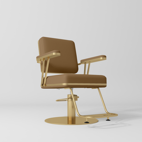 Manufakturo Opéra styling chair in Caramel with padded armrests, a gold-finished round base and metal footrest