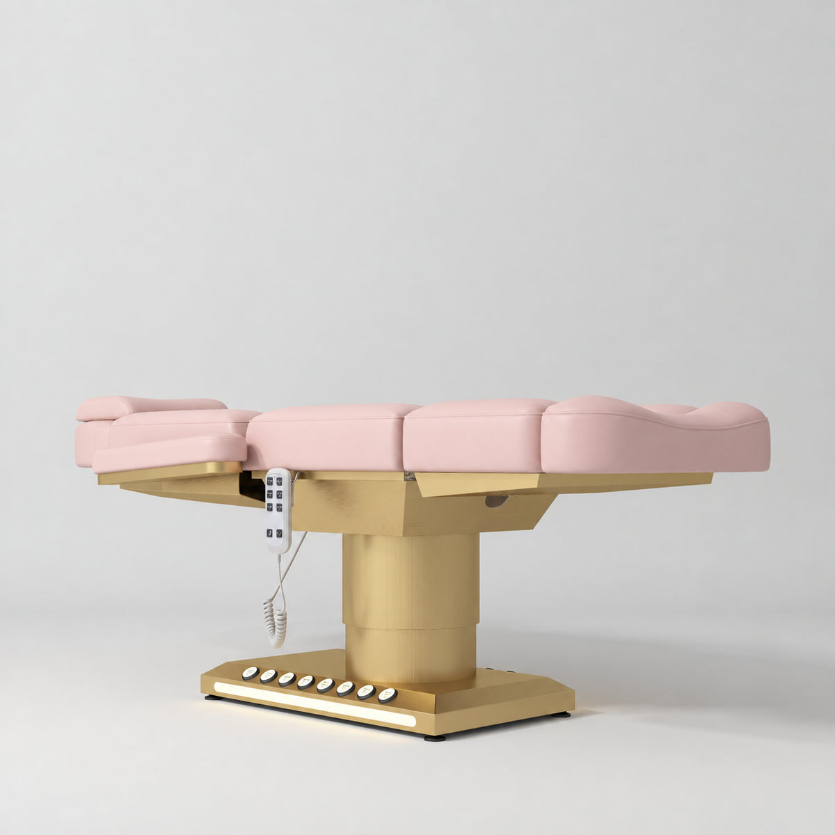Manufakturo Aurélie beauty bed in Bare Blush with gold-finished base, flat low-angle view.