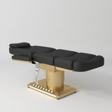 Manufakturo Aurélie beauty bed in Black with gold-finished base, flat view from above at an angle.