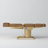 Manufakturo Aurélie beauty bed in Caramel with gold-finished base, flat side view.