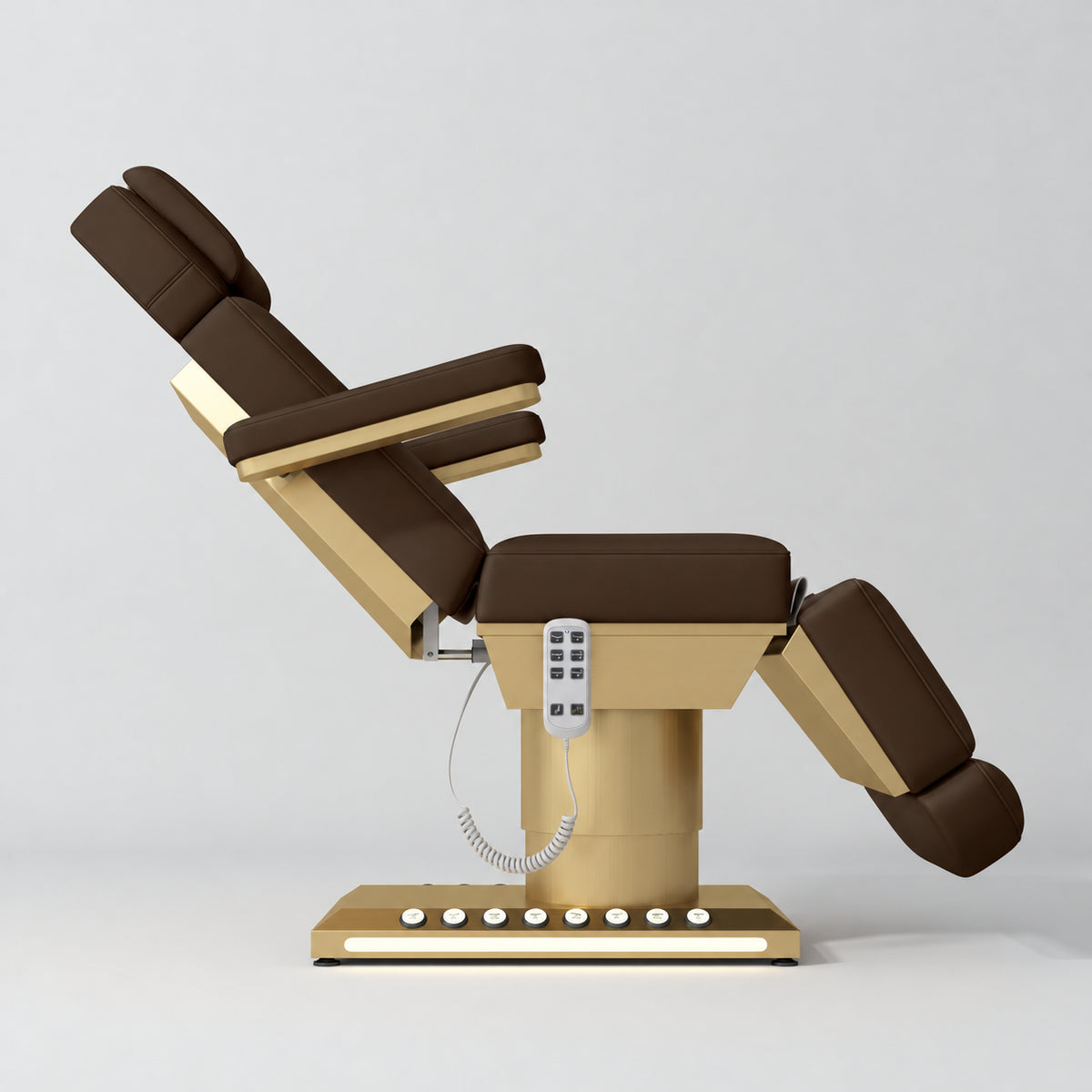 Manufakturo Aurélie beauty bed in Cocoa Mocha with gold-finished base, side view with backrest raised and leg section lowered.