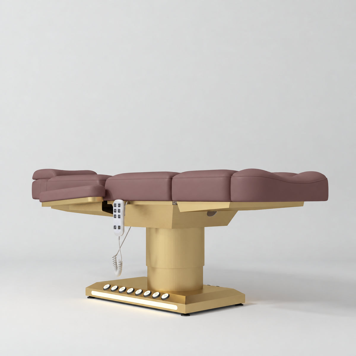 Manufakturo Aurélie beauty bed in Dusty Rose with gold-finished base, flat low-angle view.