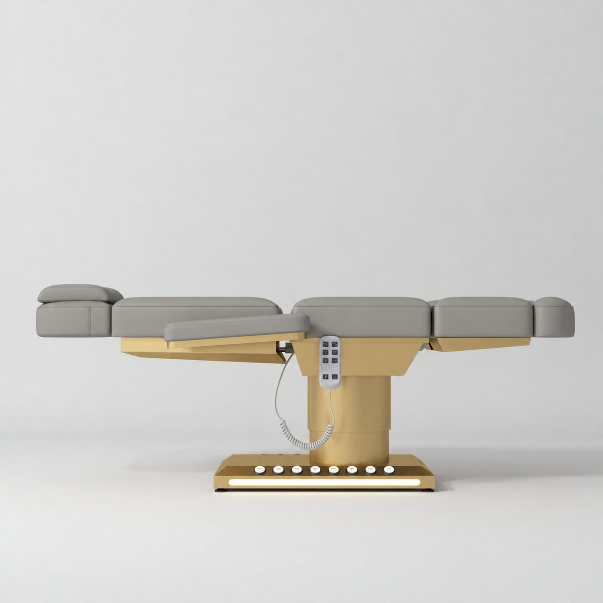 Manufakturo Aurélie beauty bed in Pearl Greige with gold-finished base, flat side view.