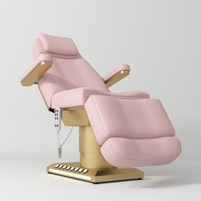 Manufakturo Aurélie beauty bed in Bare Blush with gold-finished base, reclined front three-quarter view.
