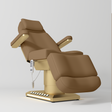 Manufakturo Aurélie beauty bed in Caramel with gold-finished base, reclined front three-quarter view.