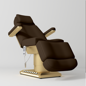 Manufakturo Aurélie beauty bed in Cocoa Mocha with gold-finished base, reclined front three-quarter view.