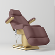 Manufakturo Aurélie beauty bed in Dusty Rose with gold-finished base, reclined front three-quarter view.