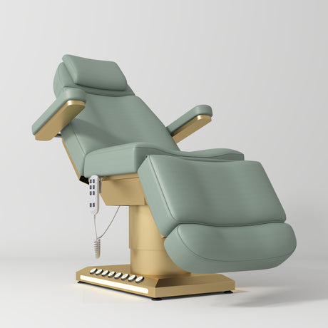 Manufakturo Aurélie beauty bed in Olive with gold-finished base, reclined front three-quarter view.