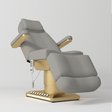 Manufakturo Aurélie beauty bed in Pearl Greige with gold-finished base, reclined front three-quarter view.
