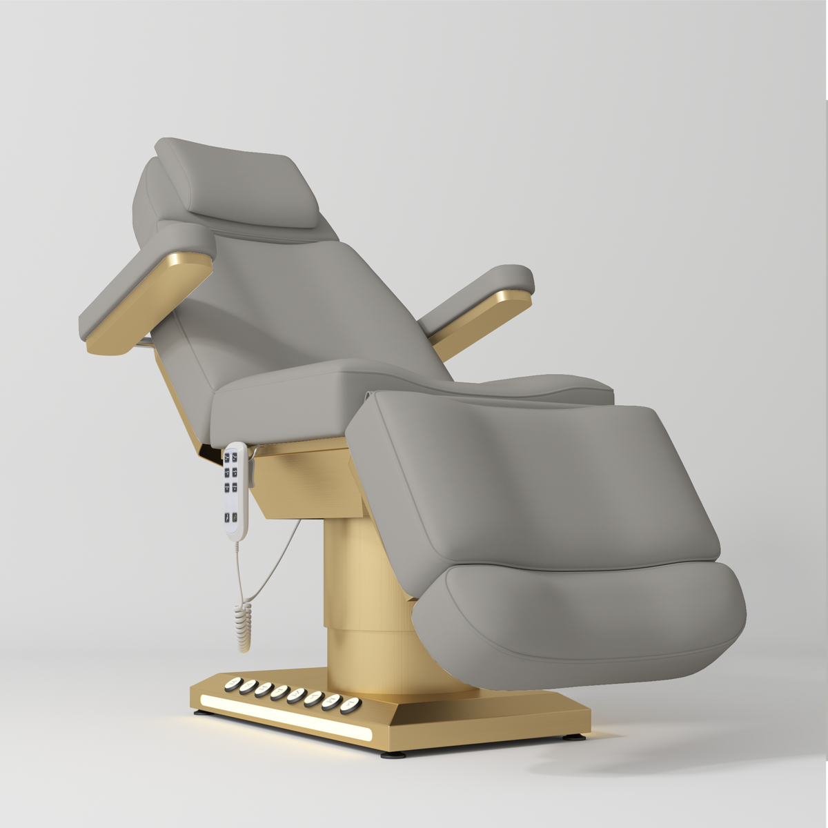 Manufakturo Aurélie beauty bed in Pearl Greige with gold-finished base, reclined front three-quarter view.