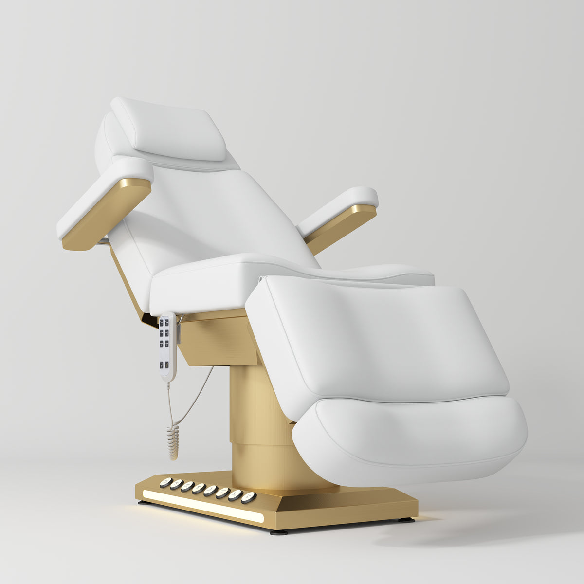Manufakturo Aurélie beauty bed in White with gold-finished base, reclined front three-quarter view.