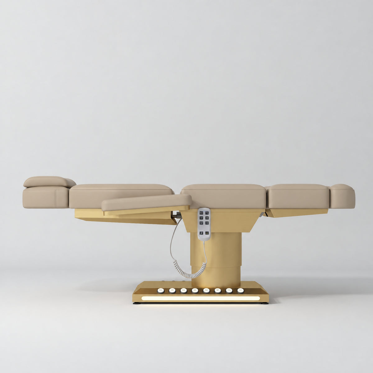 Manufakturo Aurélie beauty bed in Warm Beige with gold-finished base, flat side view.