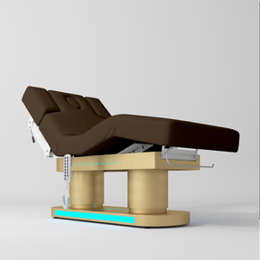 An adjustable medical or spa treatment table with a dark brown padded bed frame, beige support base, and white control panel, shown on a light gray studio background.