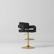 Manufakturo Mirae bar stool in Black with a panelled backrest, upholstered armrests and a gold-finished pedestal base and footrest