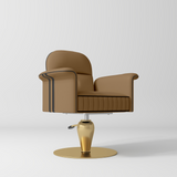 A modern salon chair with a brown upholstered seat and back, featuring dark piping along the armrests, mounted on a polished gold-colored swivel base with a round disc.
