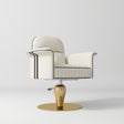A modern salon chair with cream-colored leather upholstery, black piping details, and a metallic gold pedestal base on a light gray background.