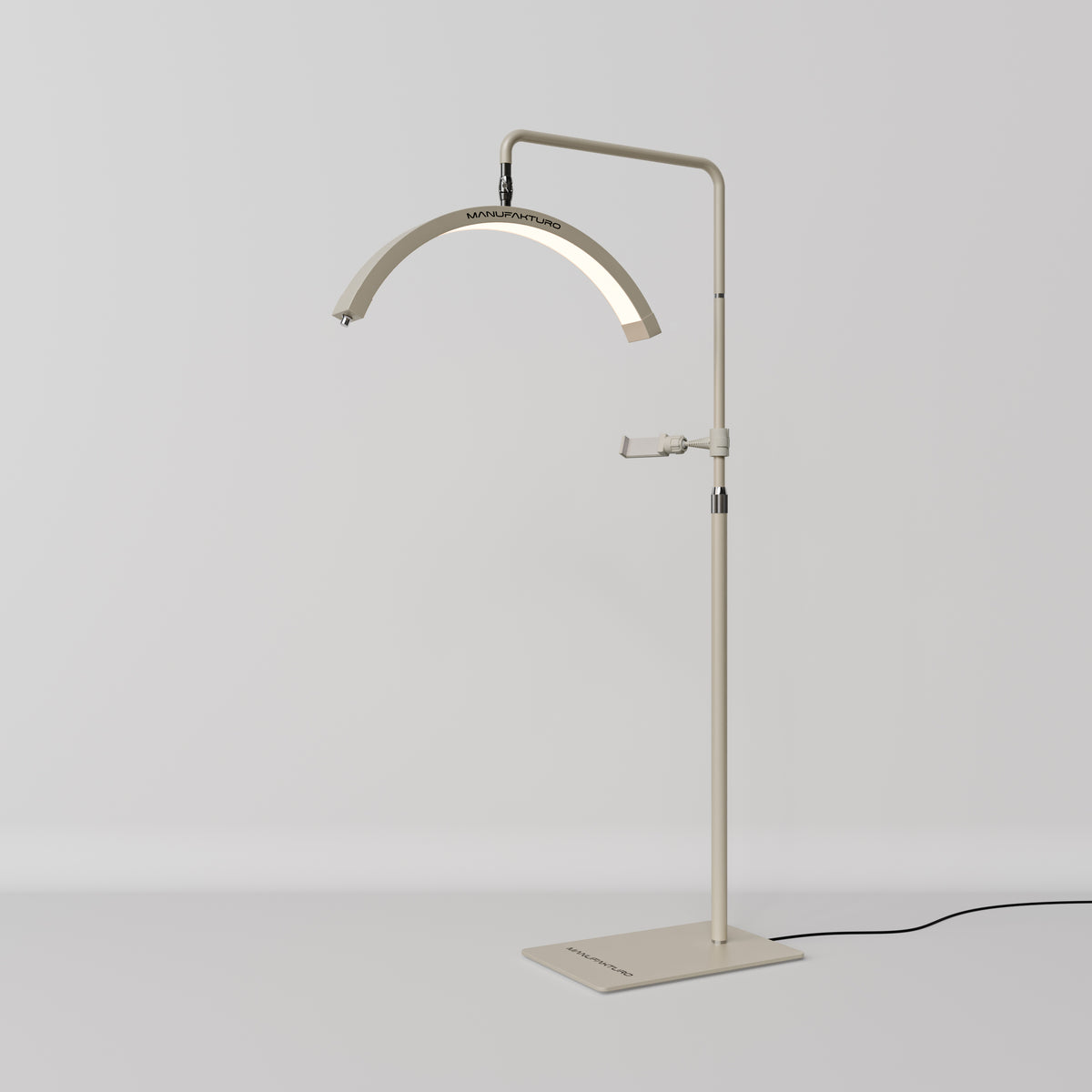 A modern floor lamp with a slim, adjustable stand and an arched light bar, finished in a warm cream or beige tone. The lamp is shown against a clean, light gray studio background with its power cord visible on the right.