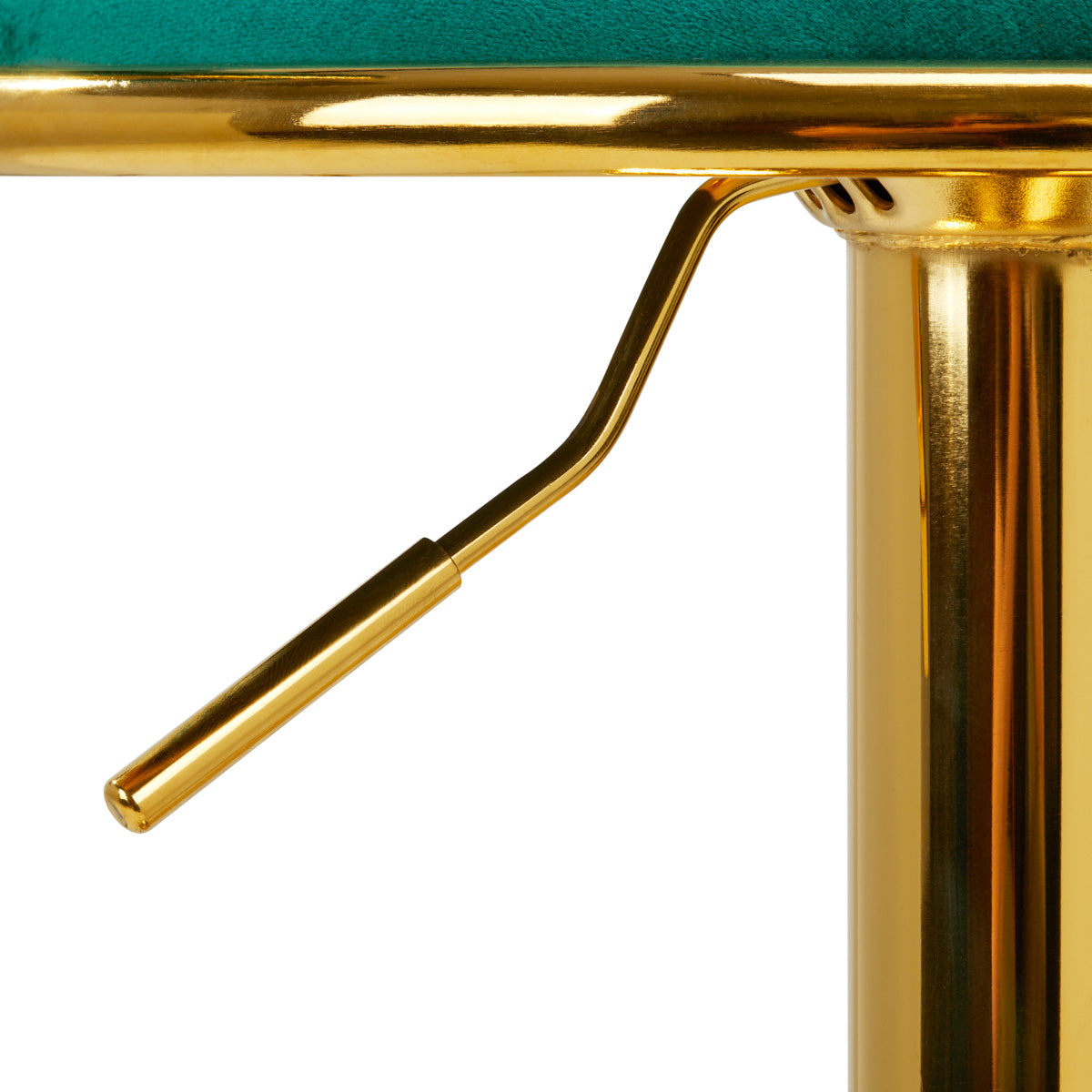 a close up of a gold metal table with a green cushion