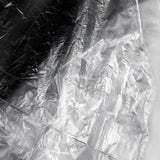 ActiveShop Disposable Hairdresser / Barber Cape 120 × 150cm 100 pcs - product displayed with its packaging on a dark background