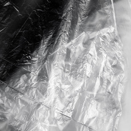 ActiveShop Disposable Hairdresser / Barber Cape 120 × 150cm 100 pcs - product displayed with its packaging on a dark background