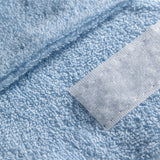 ActiveShop Terry Cosmetic Headband Blue - product displayed with its packaging on a dark background