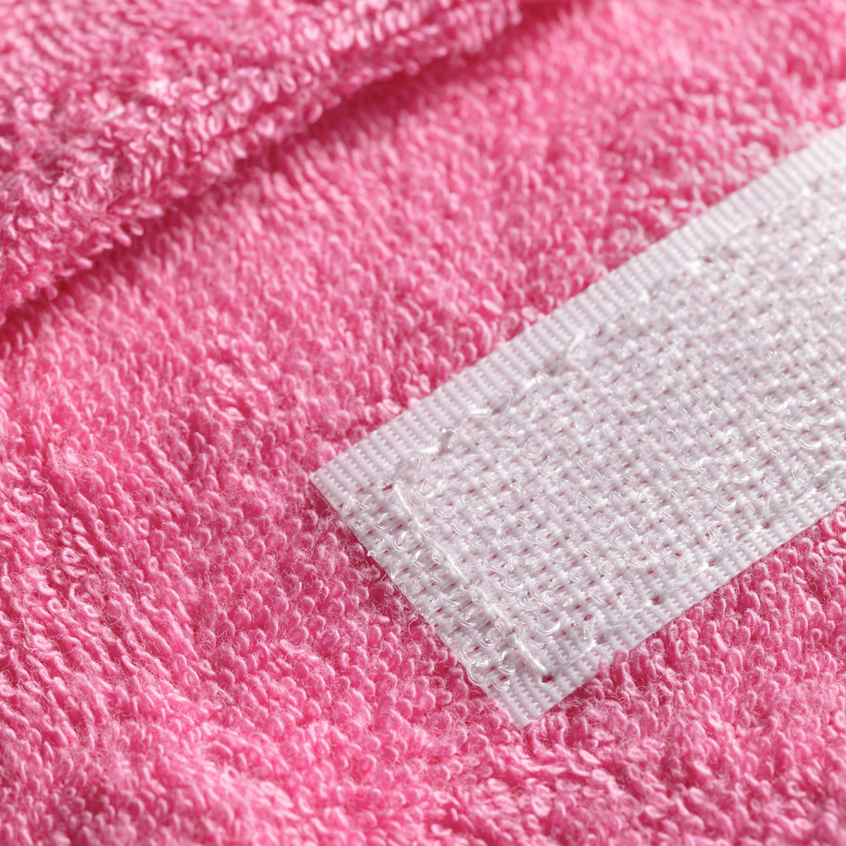 ActiveShop Terry Cosmetic Headband Pink - product displayed with its packaging on a dark background