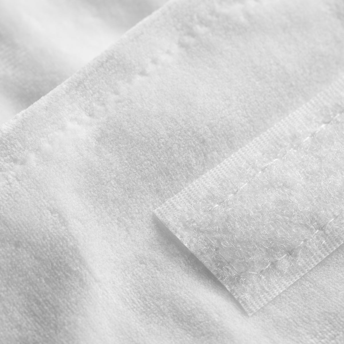 ActiveShop Velour Cosmetic Treatment Headband White - product displayed with its packaging on a dark background