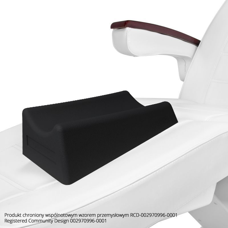 a close up of a white chair with a black pillow on it