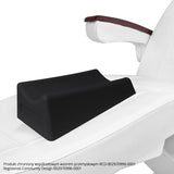 a close up of a white chair with a black pillow on it