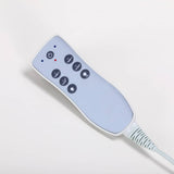 Azzurro 815B Electric Massage Bed White - displayed in a professional treatment-room setting