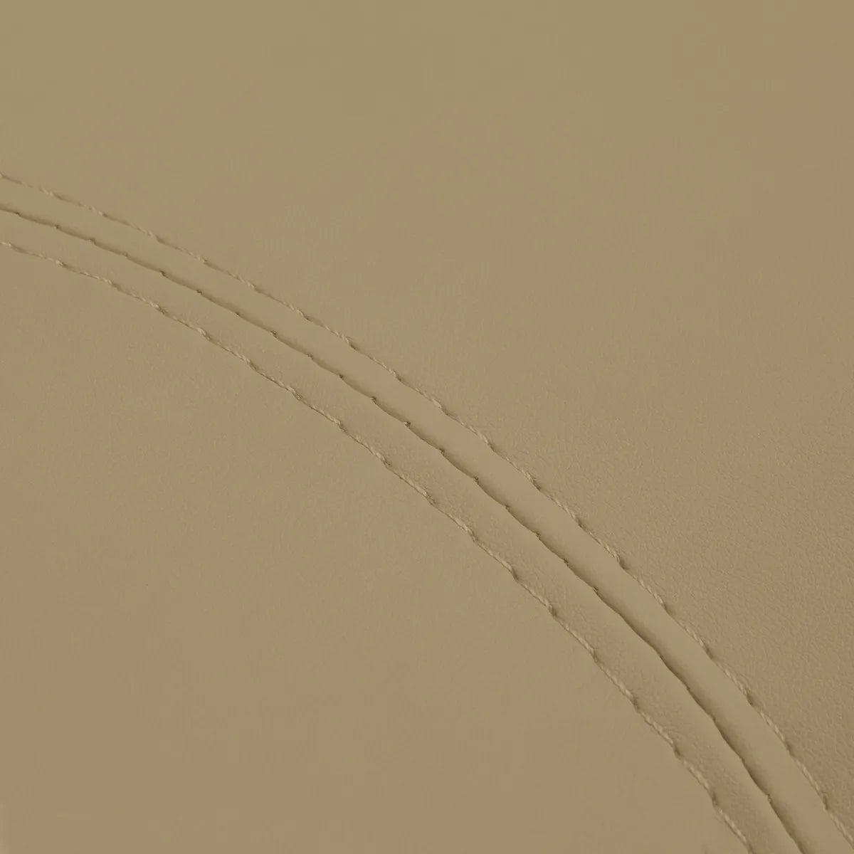 Close-up of beige faux leather upholstery and stitching