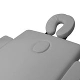 Adjustable grey face cradle and face-hole plug on the BALANCE massage table