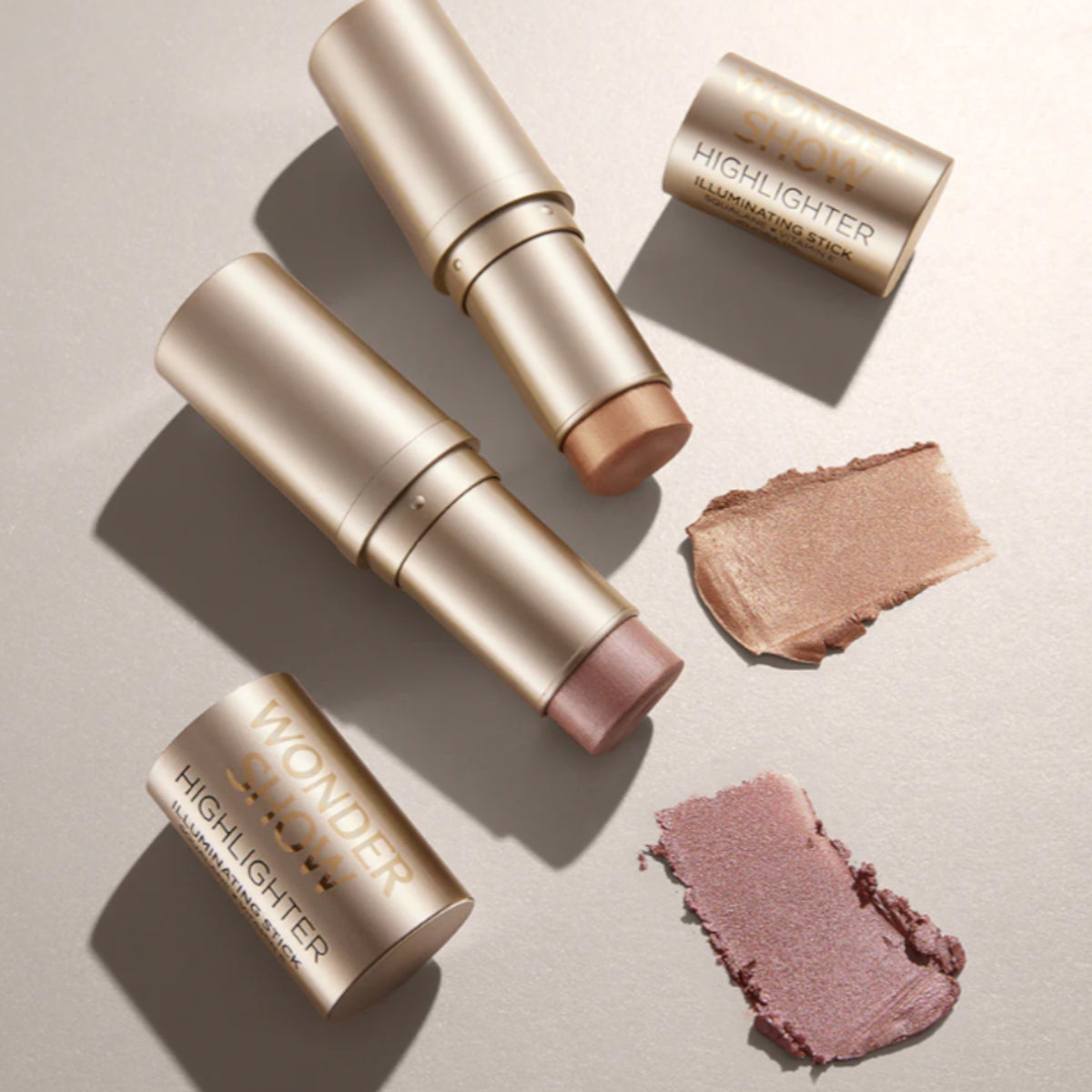 Eveline Wonder Show Highlighter Illuminating Stick - shade swatches shown beside the product