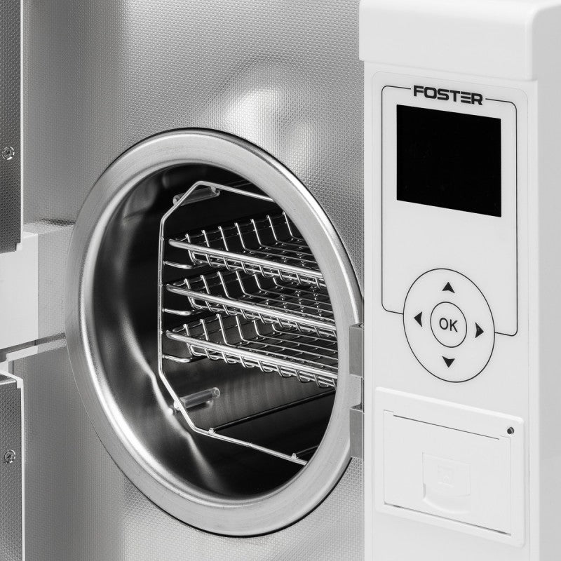 Fomos Foster 8L autoclave: open stainless-steel chamber with instrument trays