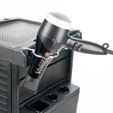 Gabbiano 100C Hairdressing Trolley Black - displayed in a professional treatment-room setting