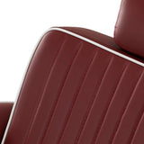Close-up of the red ribbed backrest upholstery and white piping