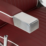 Close-up of the Gabbiano Visionerio chrome armrest and red upholstery