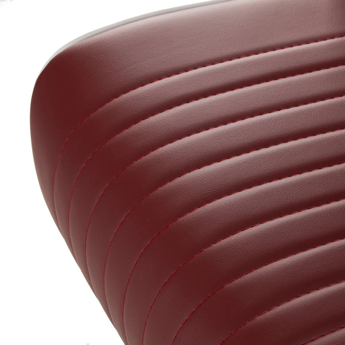 Close-up of the padded red seat and stitched upholstery