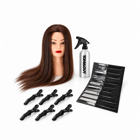Hairdressing training kit with brown-haired Gabbiano WZ2 head, nine Toni&Guy combs, silver spray bottle and six black clips.