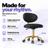 Manufakturo Aura Black beauty stool with gas-lift height adjustment, 360-degree swivel, padded backrest, gold five-spoke base, five castors and 150 kg maximum load.