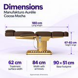 Manufakturo Aurélie Cocoa Mocha beauty bed dimensions: 180 cm length, 62 cm treatment surface width, 84 cm width with armrests, 67–82 cm height and 90 x 51 cm base footprint.