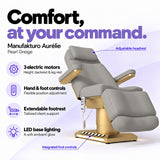 Manufakturo Aurélie Pearl Greige electric beauty bed with 3 motors, hand and integrated foot controls, extendable footrest, adjustable headrest and LED base lighting.