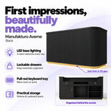 Manufakturo Averne Black reception desk with LED base lighting, lockable drawers, pull-out keyboard tray and shelves and cupboard storage.