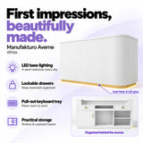Manufakturo Averne White reception desk with LED base lighting, lockable drawers, pull-out keyboard tray and shelves and cupboard storage.