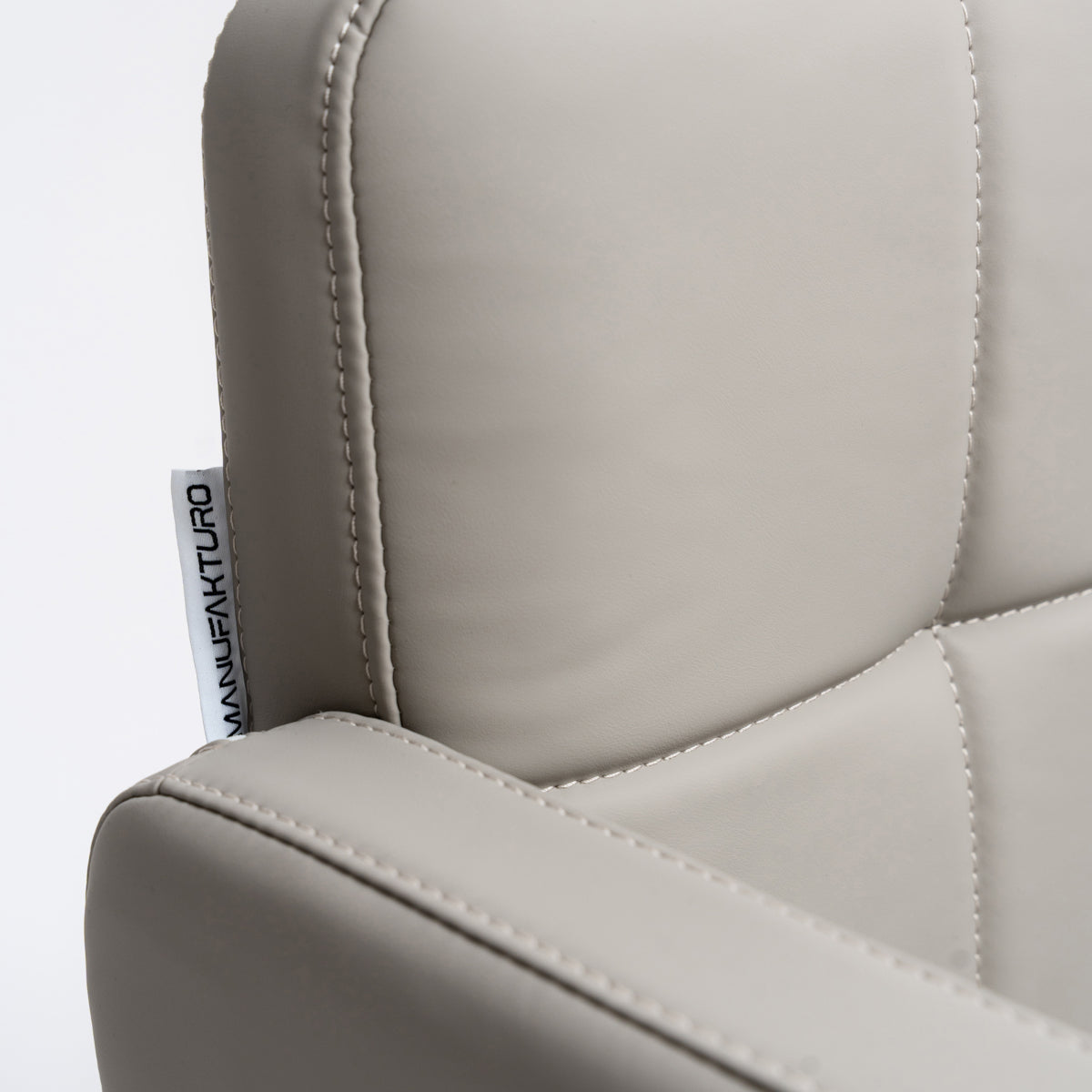 Manufakturo Serenity Salon Chair - 360-Degree Rotation Gold Base Black - close-up of the upholstery and construction details